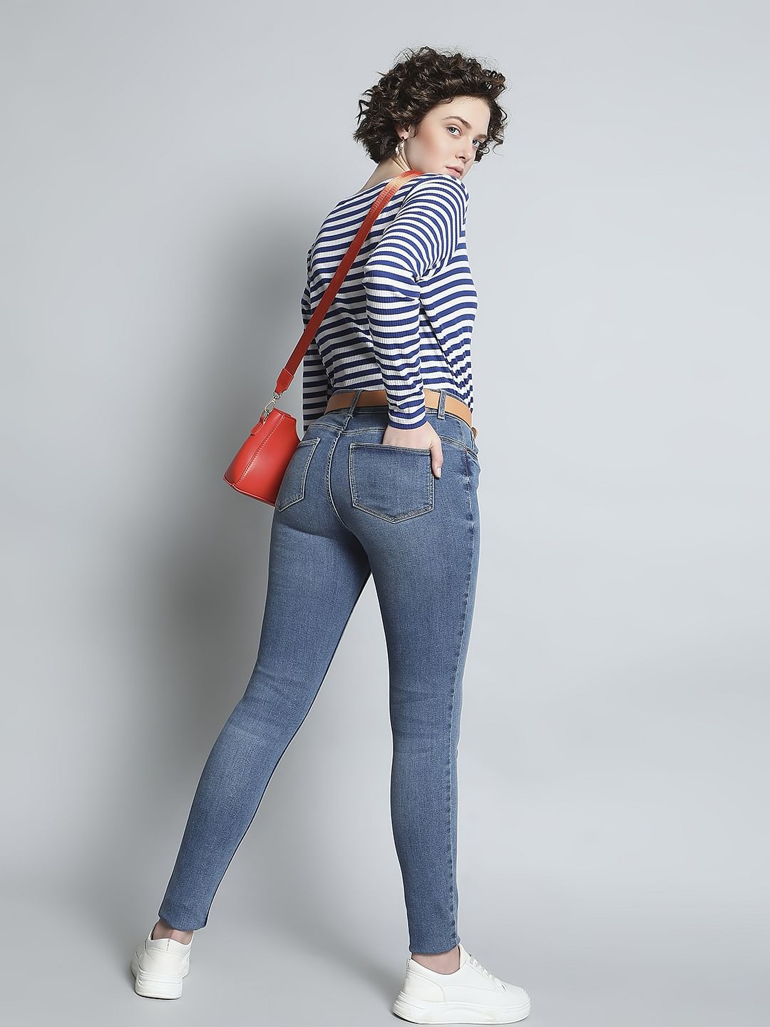 Blue Mid Rise Mildly Distressed Slim Jeans
